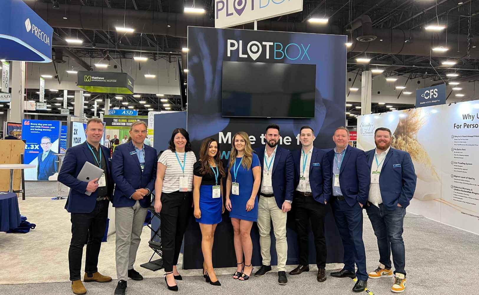 PlotBox staff at a conference